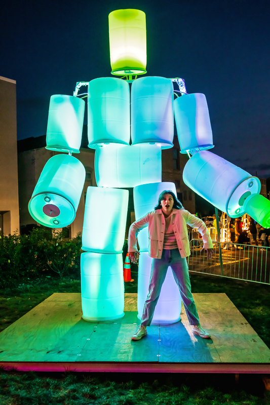 Senior girl in downtown Aurora during street festival lights